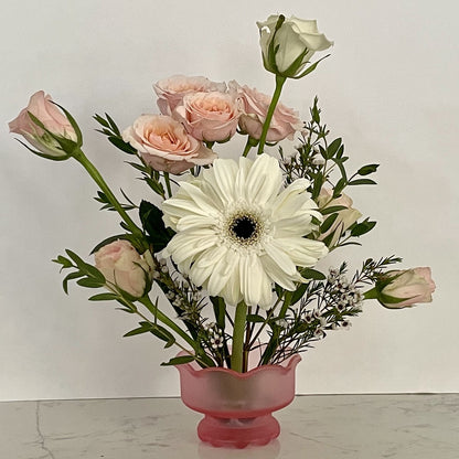 Pale pink frosted vase with flower frog built in allowing for stylish floral arrangement.   