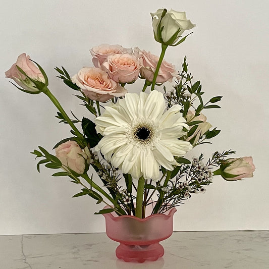 Pale pink frosted vase with flower frog built in allowing for stylish floral arrangement.   
