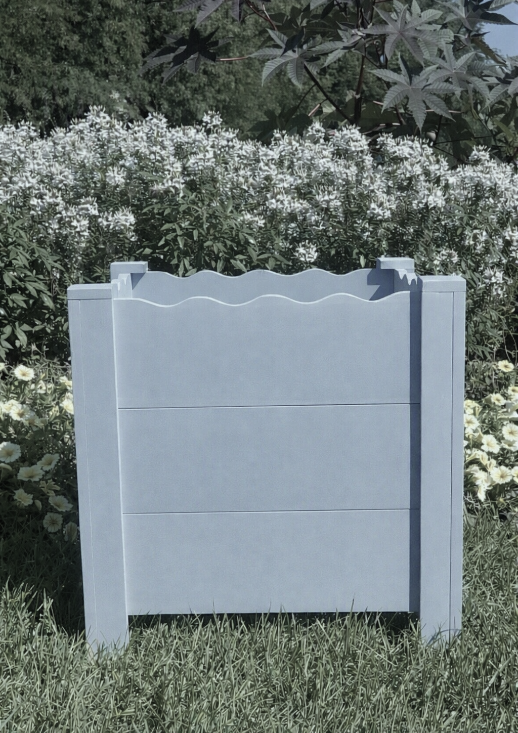 Handcrafted scalloped cedar planter box in Languid Blue, 19" square, shown in garden