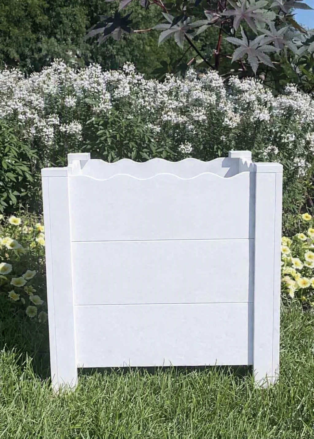 A large, square white cedar planter with scalloped edge.  Handcrafted unique design and looks great on a porch or back deck