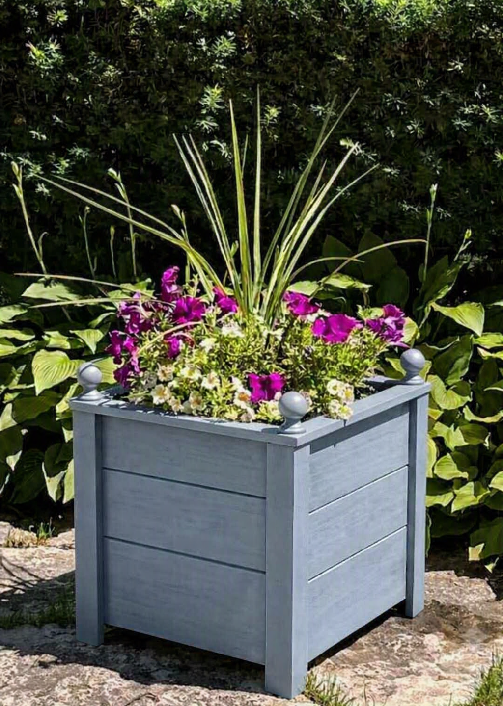 A light blue gray handcrafted cedar planter box.   Unique design and very durable.   Looks great on your front porch or back deck.   Comes fully assembled and offers free shipping. 