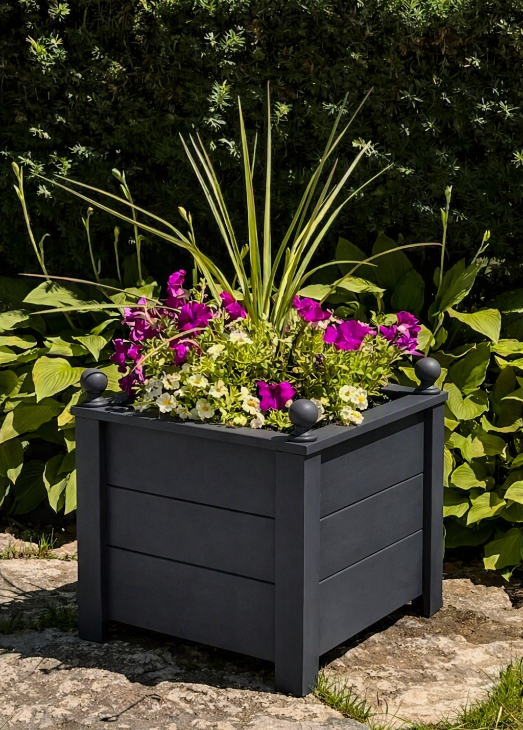 A dark gray handcrafted cedar planter box.   Unique design and very durable.   Looks great on your front porch or back deck.   Comes fully assembled and offers free shipping. 